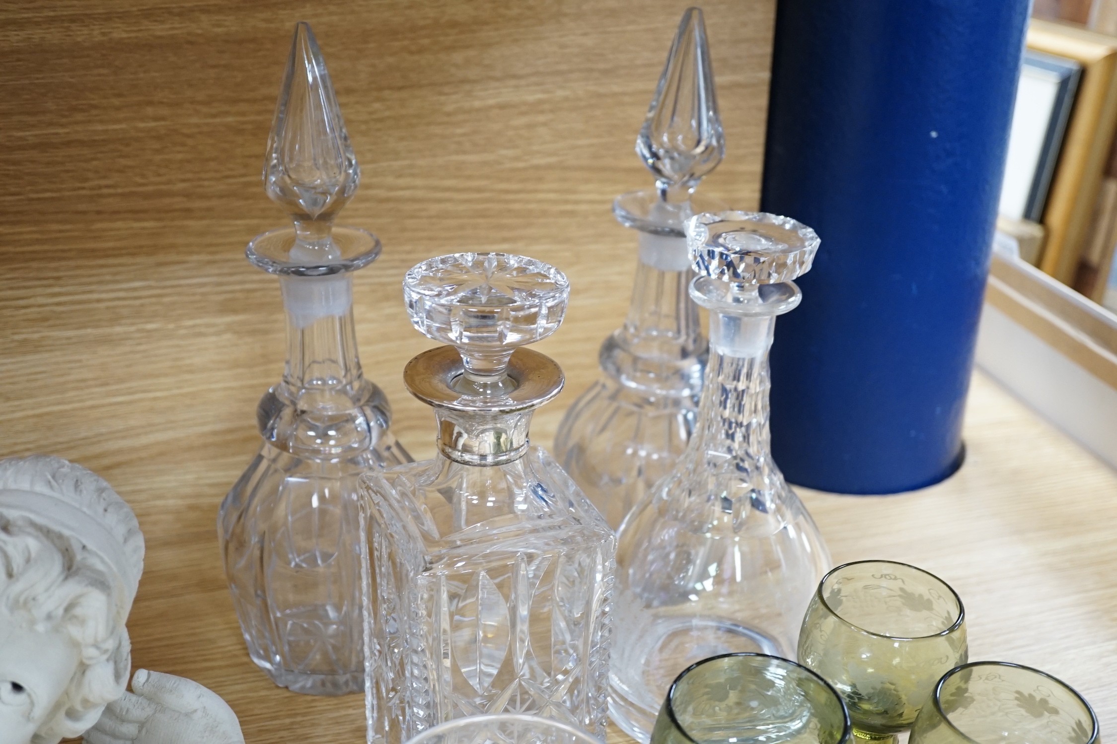 A pair of rummers, three glass decanters, a silver mounted decanter and nine etched green glass goblets, tallest 34cm